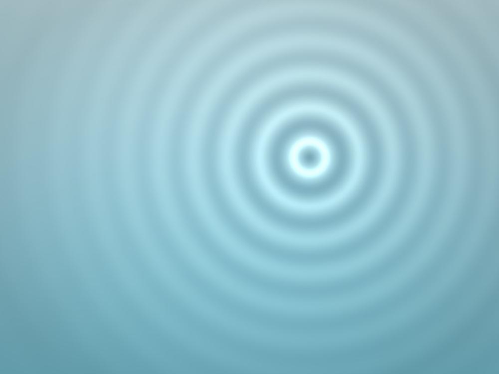 Rings spreading across still water